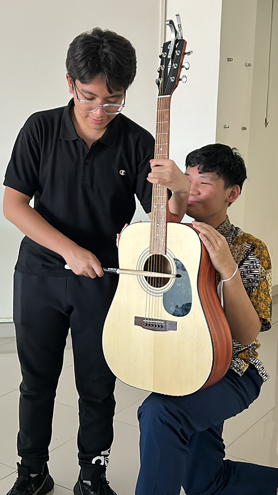me holding a guitar